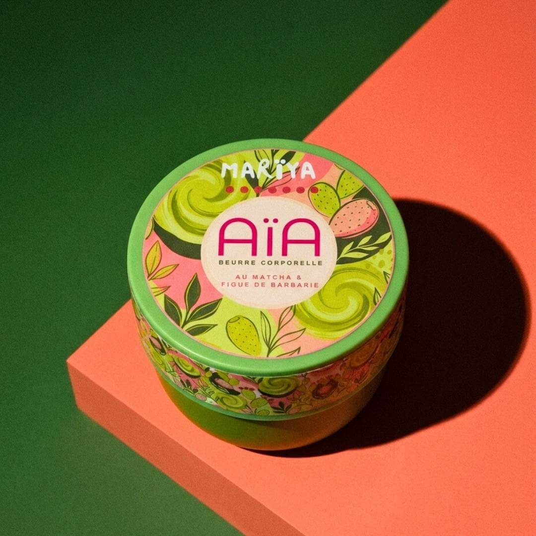 AÏA Beurre corporel nourrissant au Matcha et Figue de Barbarie dans un pot coloré.